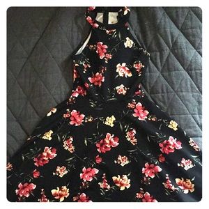 This is a beautiful, floral, curve-fitting dress.